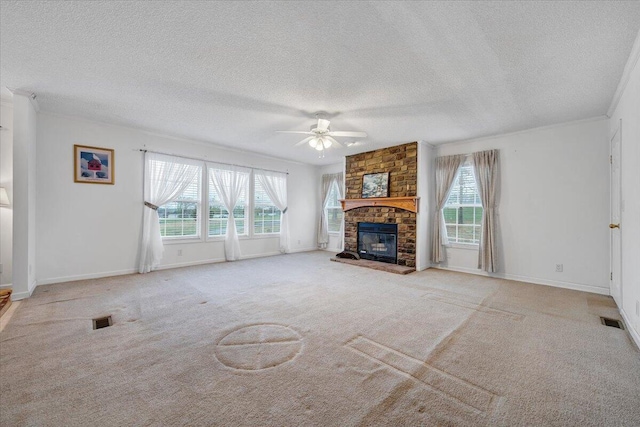 unfurnished living room featuring visible vents, ceiling fan, and plenty of natural light