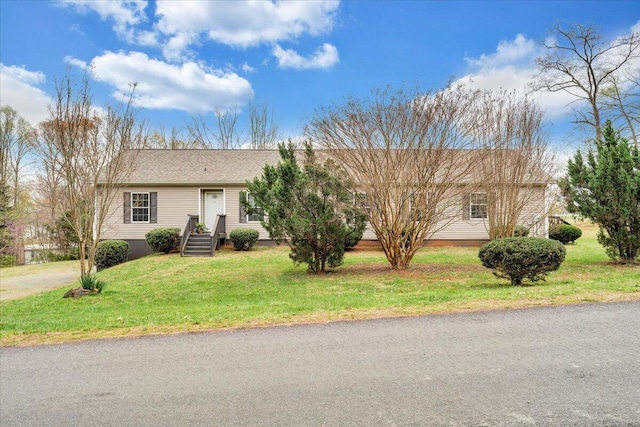 ranch-style home with a front yard