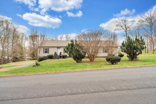 ranch-style home with a front lawn