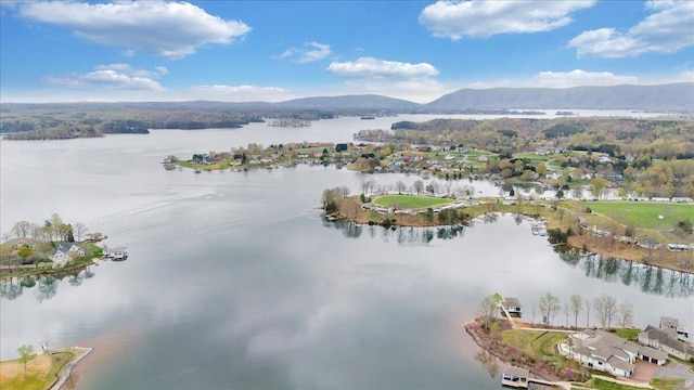 drone / aerial view with a water and mountain view