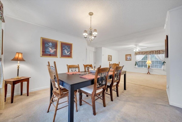 dining room with light carpet, a textured ceiling, crown molding, and ceiling fan with notable chandelier