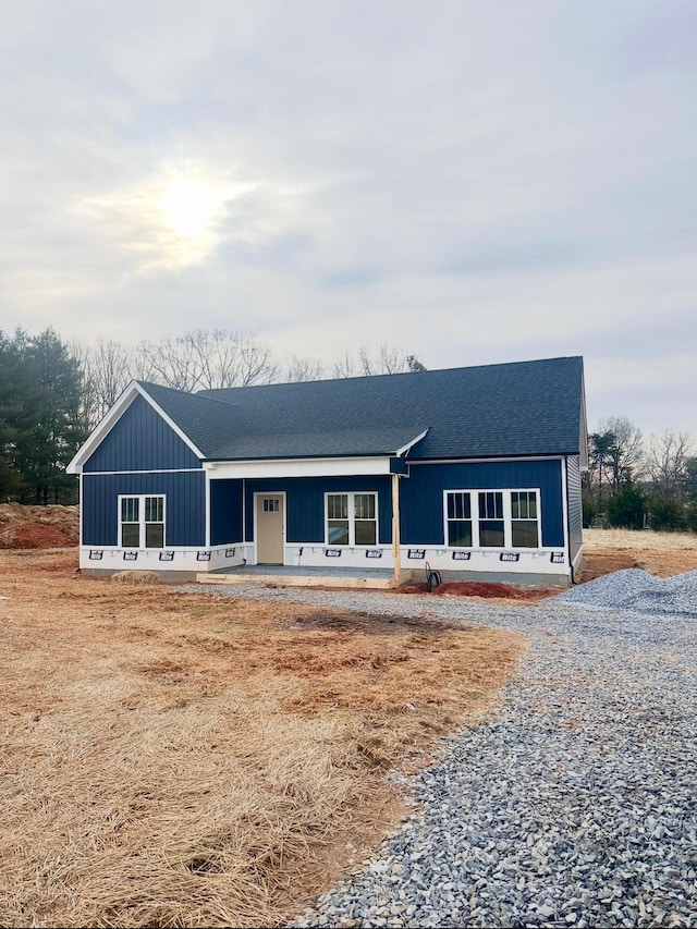 view of front of house with roof with shingles