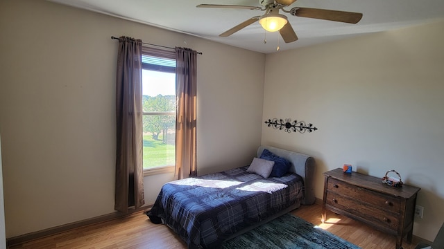 bedroom featuring ceiling fan and light wood finished floors