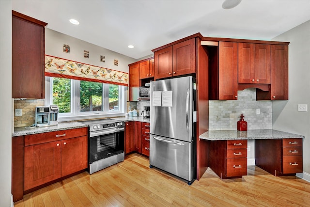 kitchen with stainless steel appliances, light wood finished floors, backsplash, and light stone countertops