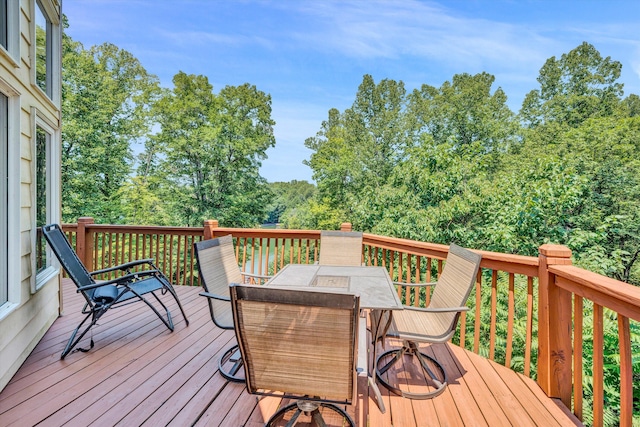 wooden deck with outdoor dining space