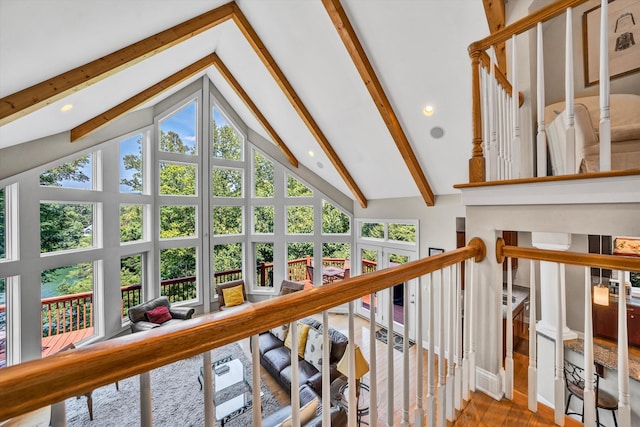 interior space featuring lofted ceiling with beams