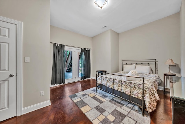 bedroom featuring baseboards and visible vents