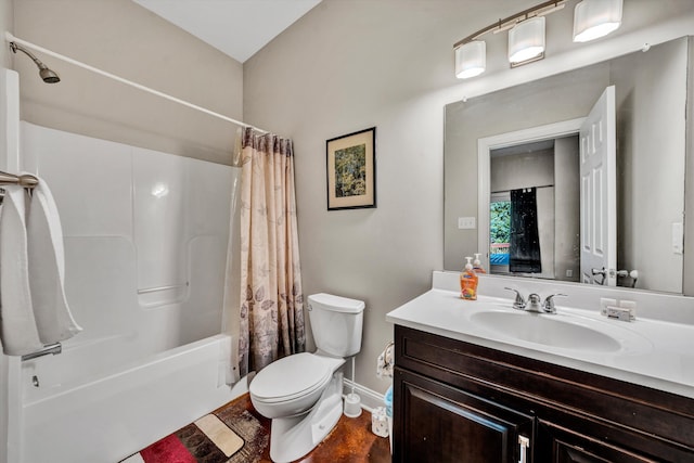 bathroom featuring toilet, baseboards, shower / tub combo with curtain, and vanity