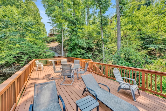 deck featuring outdoor dining area