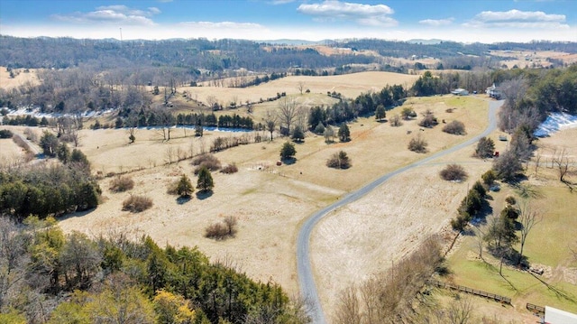 birds eye view of property with a rural view