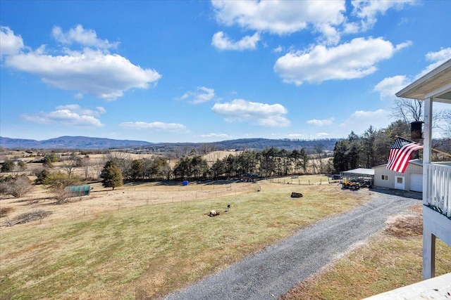 mountain view featuring a rural view