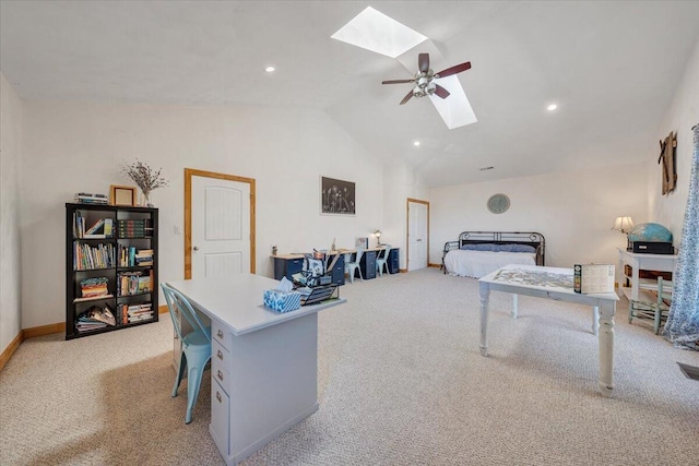 bedroom with light carpet, lofted ceiling with skylight, a ceiling fan, and baseboards