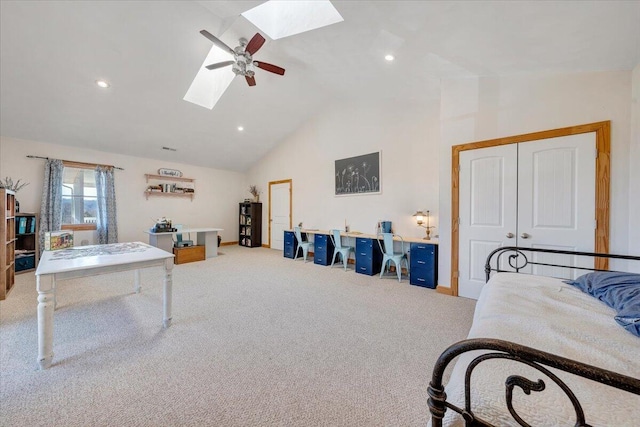 interior space featuring ceiling fan, high vaulted ceiling, a skylight, and recessed lighting