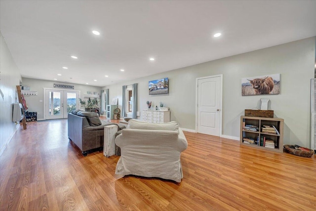 living area with light wood-type flooring, french doors, baseboards, and recessed lighting