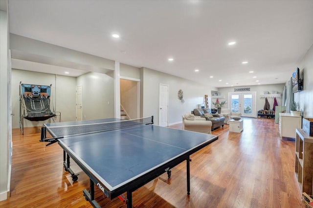 playroom featuring french doors, light wood-type flooring, and recessed lighting