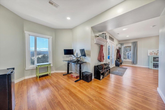 interior space with recessed lighting, wood finished floors, visible vents, and baseboards