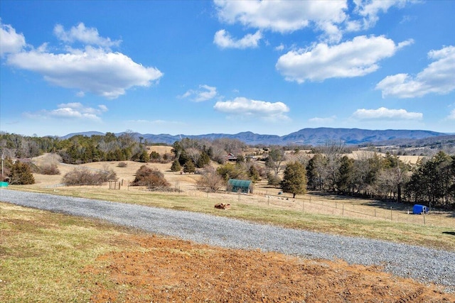 mountain view featuring a rural view