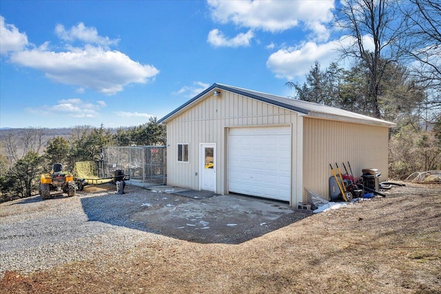 detached garage featuring driveway