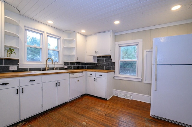 kitchen with open shelves, visible vents, white cabinets, a sink, and white appliances