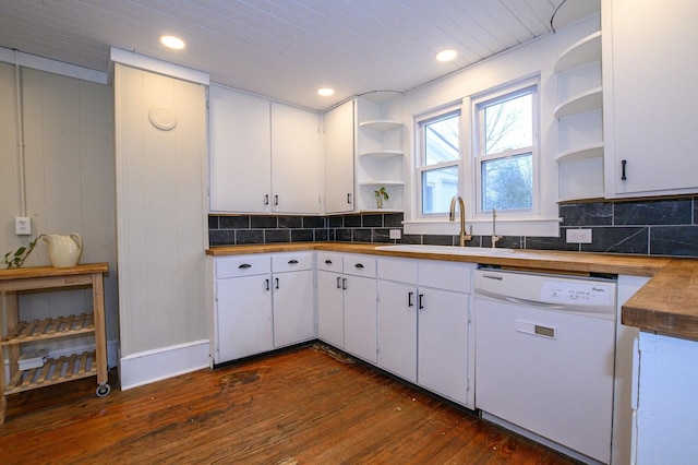 kitchen featuring decorative backsplash, white dishwasher, a sink, and open shelves