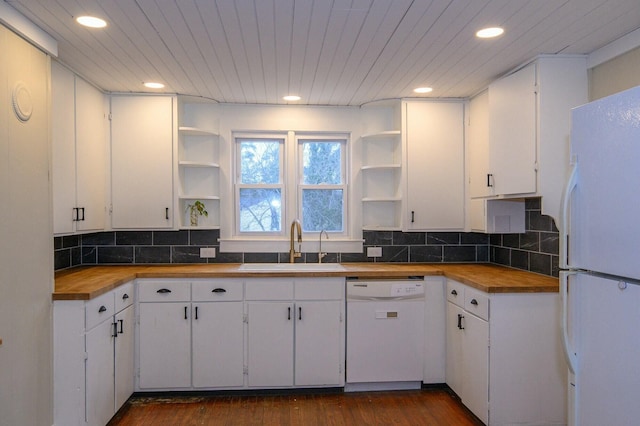 kitchen with white appliances, wooden counters, a sink, and open shelves