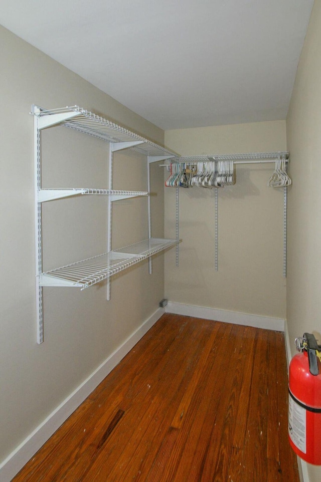 spacious closet featuring wood finished floors