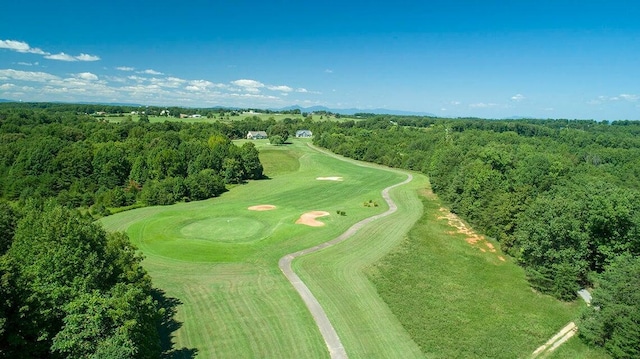 birds eye view of property featuring a wooded view and golf course view