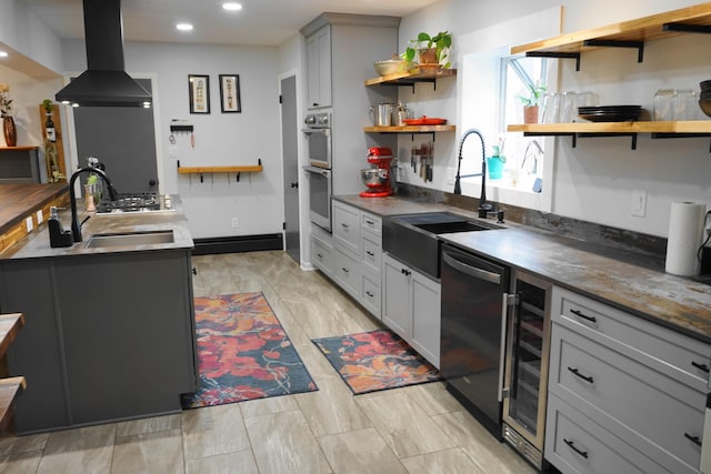 kitchen featuring dishwashing machine, beverage cooler, a sink, exhaust hood, and open shelves