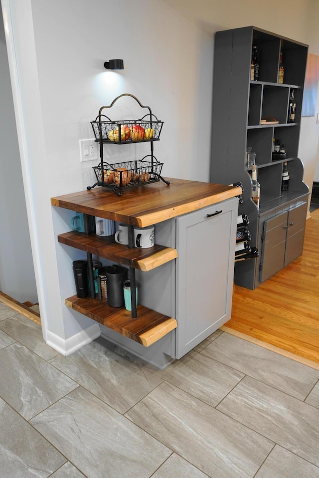 interior space featuring baseboards and wood finished floors