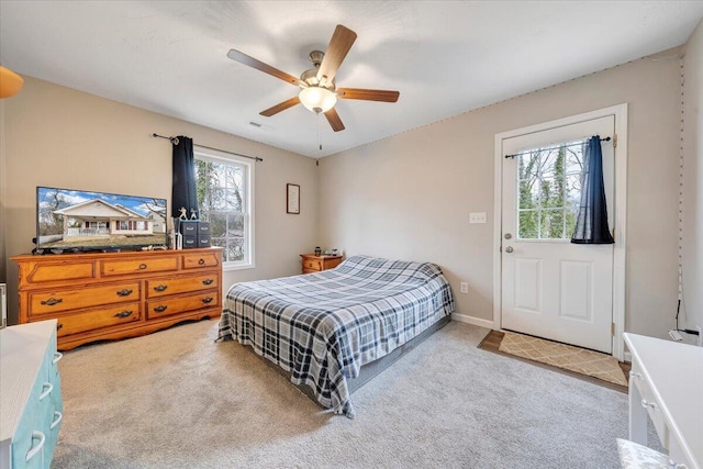 bedroom with carpet floors, baseboards, and a ceiling fan