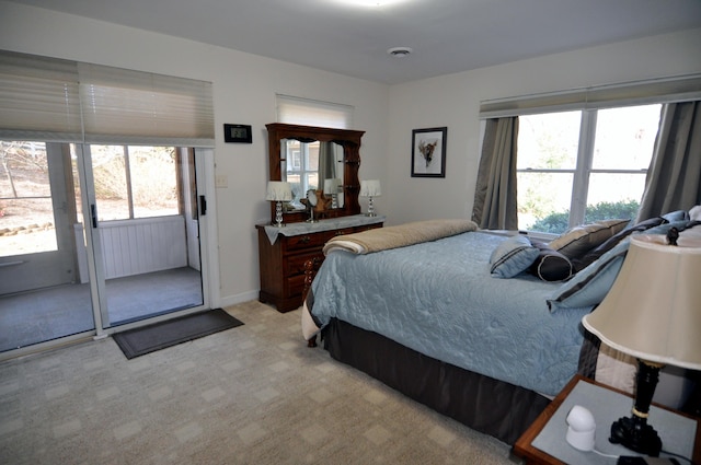 3370 Kelly Lane Ext, Roanoke, VA 24018 - bedroom with access to exterior, multiple windows, and light carpet