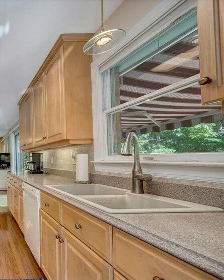 3370 Kelly Lane Ext, Roanoke, VA 24018 - kitchen with dishwasher, light wood-style flooring, light countertops, and decorative light fixtures