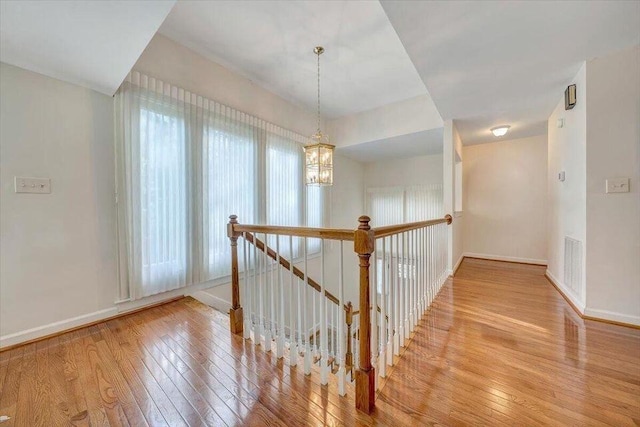 3370 Kelly Lane Ext, Roanoke, VA 24018 - corridor with an upstairs landing, wood-type flooring, and a chandelier