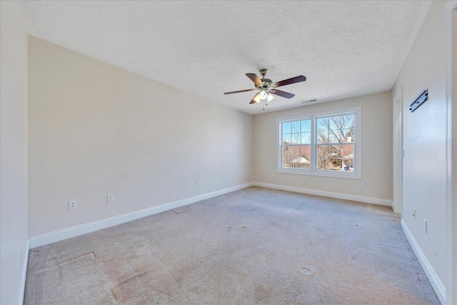 unfurnished room with visible vents, baseboards, light carpet, and ceiling fan