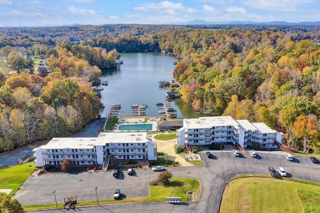 bird's eye view featuring a water view and a forest view