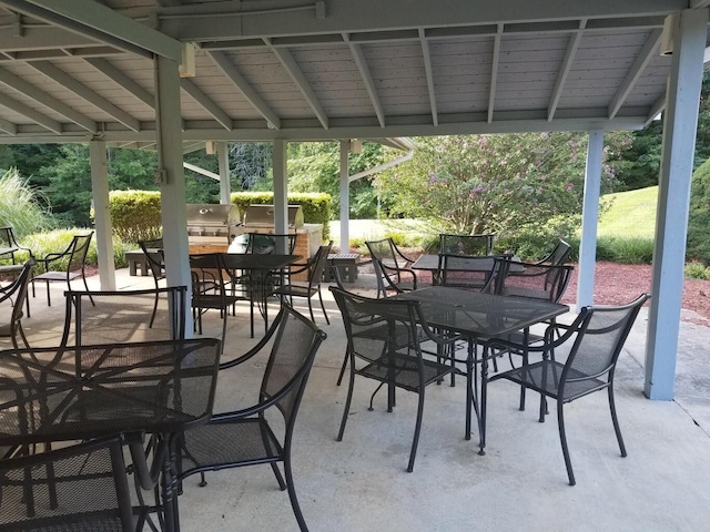 view of patio / terrace featuring an outdoor kitchen and outdoor dining space