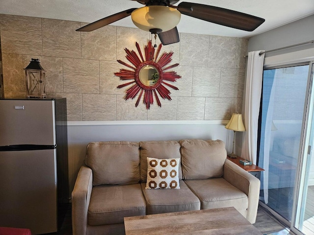 living room with a ceiling fan