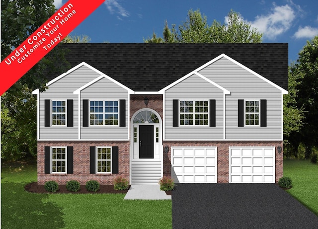 raised ranch featuring a garage, brick siding, driveway, and a front yard