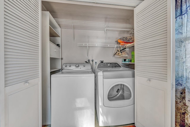 clothes washing area with laundry area and washing machine and dryer