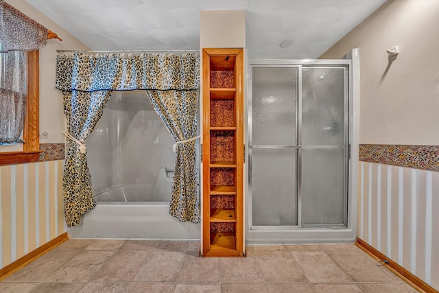 bathroom with baseboards and an enclosed shower