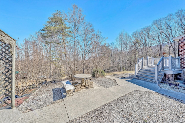 view of patio / terrace featuring a wooden deck