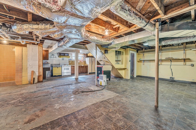 basement featuring freestanding refrigerator