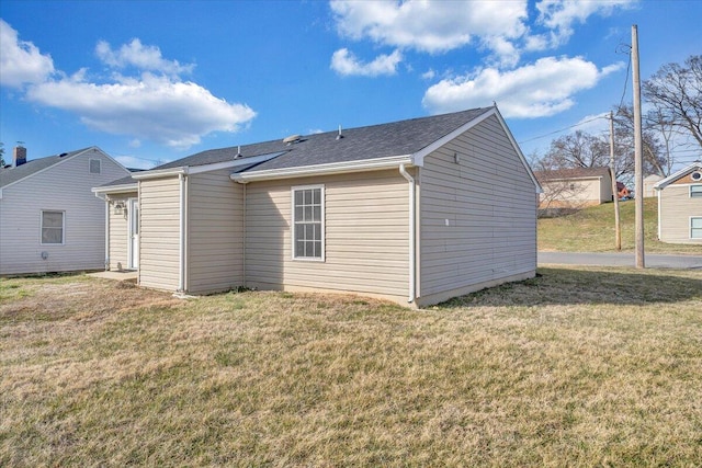 back of house with a yard