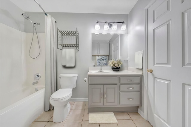 bathroom with shower / bath combination with curtain, toilet, vanity, baseboards, and tile patterned floors