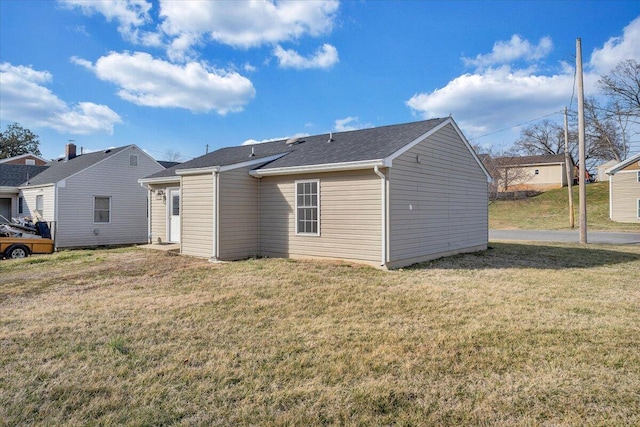 back of house with a yard