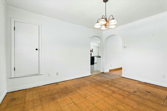 2351 Reese Mountain Rd, Elliston, VA 24087 - spare room with arched walkways, a notable chandelier, baseboards, and ornamental molding
