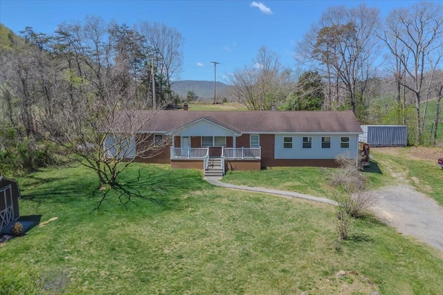 2351 Reese Mountain Rd, Elliston, VA 24087 - ranch-style house featuring dirt driveway, a porch, and a front lawn