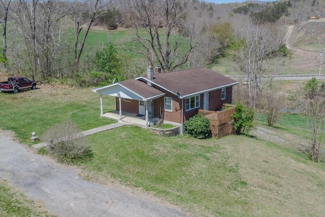 2351 Reese Mountain Rd, Elliston, VA 24087 - ranch-style home with a chimney, brick siding, and a front yard