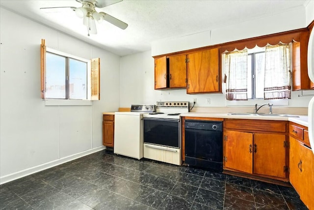2351 Reese Mountain Rd, Elliston, VA 24087 - kitchen with brown cabinets, dishwasher, a sink, washer / dryer, and white electric range oven