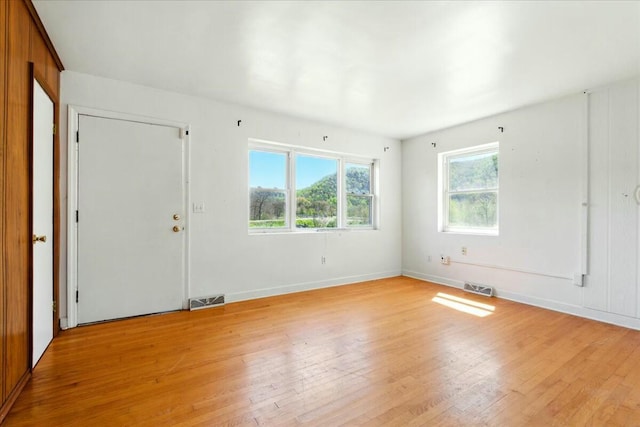 2351 Reese Mountain Rd, Elliston, VA 24087 - unfurnished room with baseboards, light wood-style flooring, and visible vents